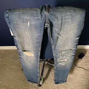 Distressed denim jeans